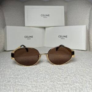 Gold-tone oval sunglasses with brown gradient lens