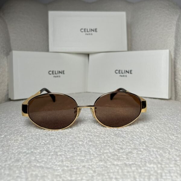 Gold-tone oval sunglasses with brown gradient lens