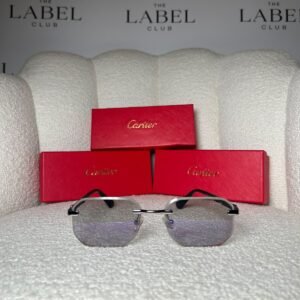 Rimless angular sunglasses with clear grey gradient lenses and black temples