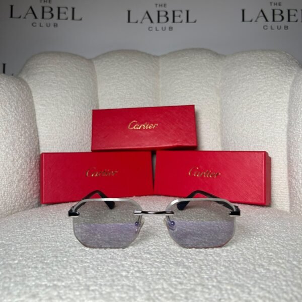 Rimless angular sunglasses with clear grey gradient lenses and black temples