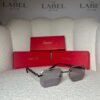 Rimless angular sunglasses with black temples, angled view