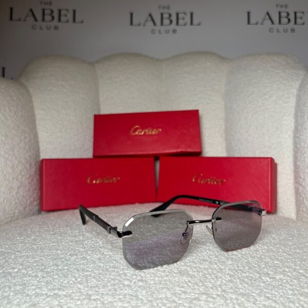 Rimless angular sunglasses with black temples, angled view