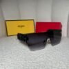 Black and gold rimless shield sunglasses, angled view