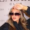 Model wearing Gucci 58137 oversized square sunglasses in black