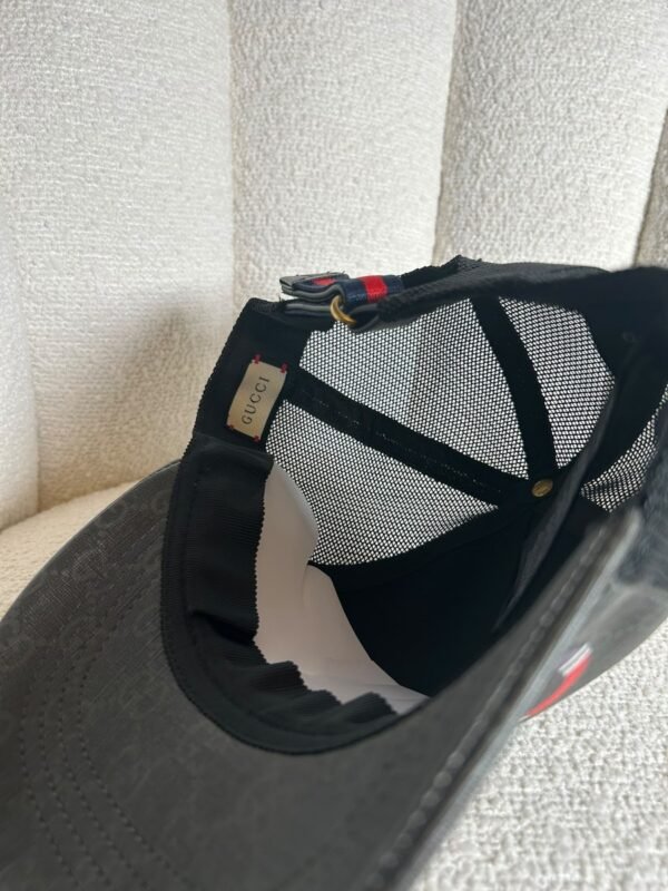 Gucci GG Supreme kingsnake trucker cap in black, interior lining and authenticity tag