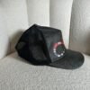 Gucci GG Supreme kingsnake trucker cap in black, side view with mesh back