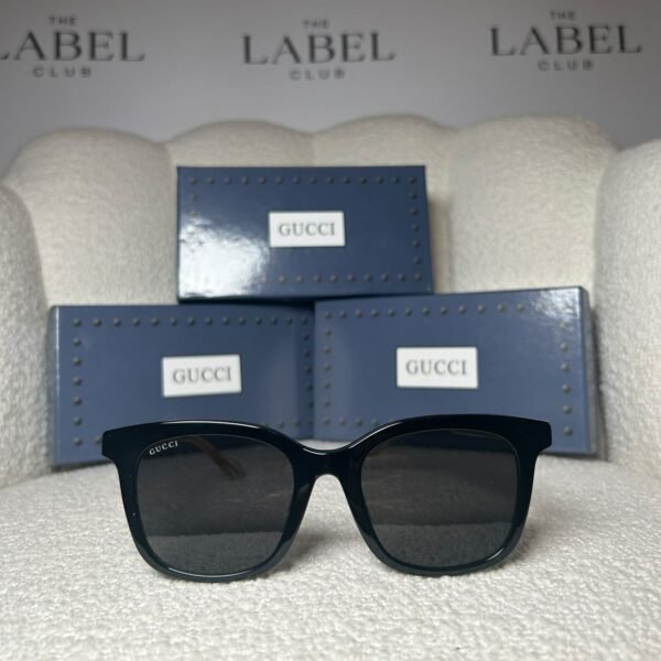 Black oversized square sunglasses with dark grey lenses