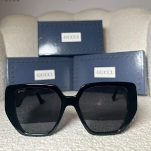 Black oversized geometric sunglasses with grey gradient lenses