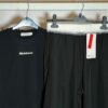 Lululemon black crop tee and wide-leg pants set, close detail