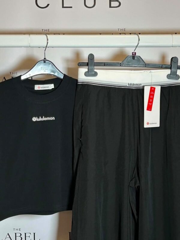 Lululemon black crop tee and wide-leg pants set, close detail