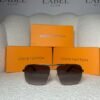 Silver double-bridge navigator sunglasses with brown gradient lenses