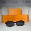 Black rectangular acetate sunglasses with dark grey lenses