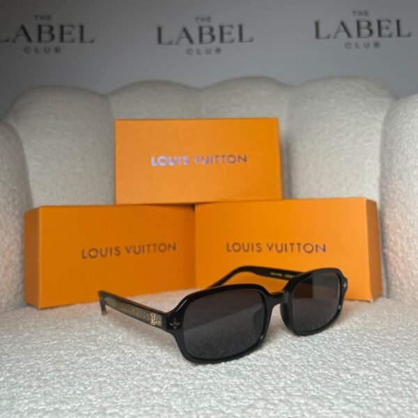 Black rectangular sunglasses, angled view showing the gold monogram temple plaque