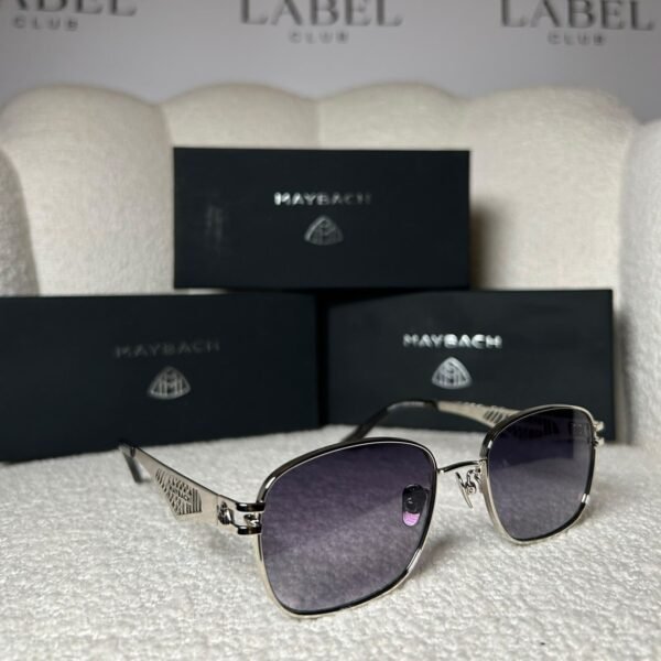 Silver rounded square sunglasses, angled view showing the lattice temple panel