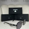 Matte black rounded square sunglasses, angled view showing the lattice temple panel