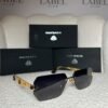 Gold rimless angular sunglasses, angled view showing the lattice temple
