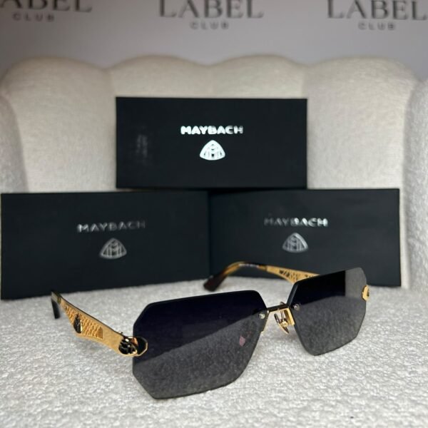 Gold rimless angular sunglasses, angled view showing the lattice temple