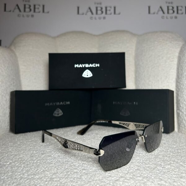 Silver rimless angular sunglasses, angled view showing the lattice temple