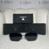 Black rimless angular sunglasses with dark smoke lenses