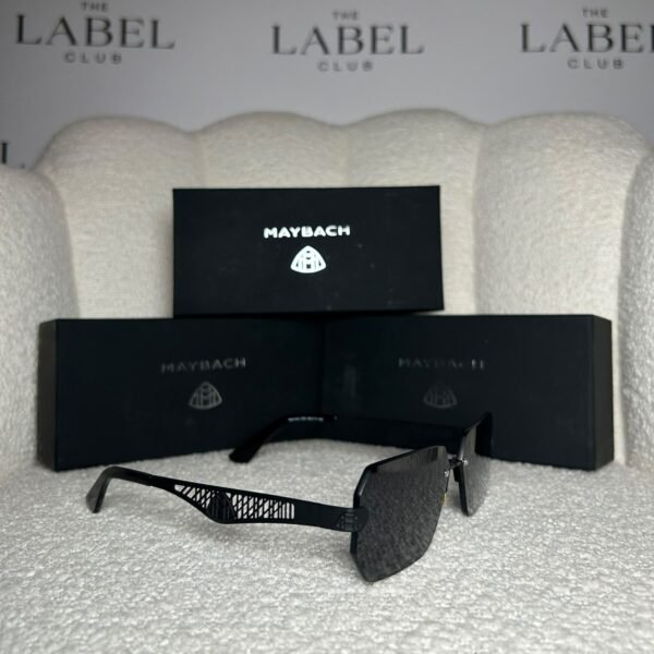 Black rimless angular sunglasses, angled view showing the lattice temple