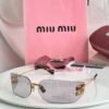 Grey and gold rimless sunglasses