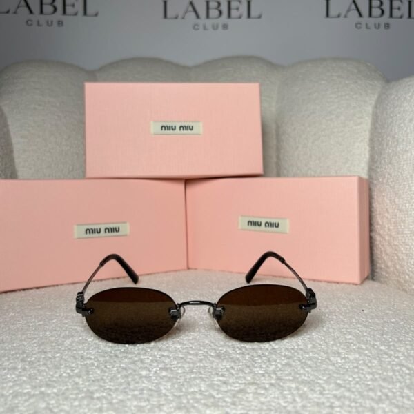 Black rimless oval sunglasses with brown lenses