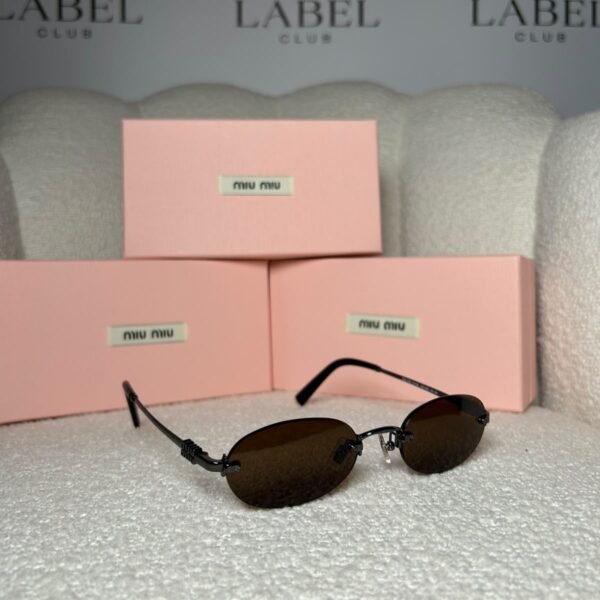 Black rimless oval sunglasses with brown lenses, angled view